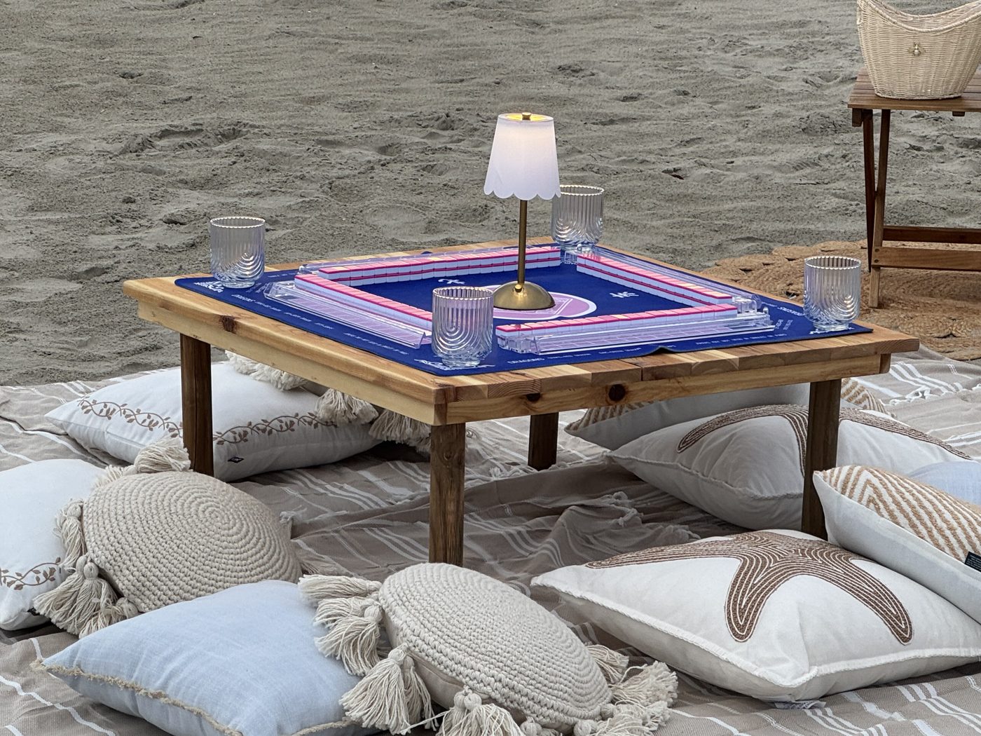 Beachside mahjong table styled at dusk